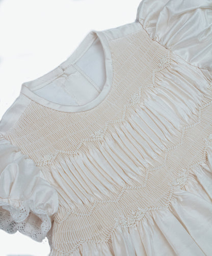 Detail of horizontal tucks and dupioni silk texture on white ivory baby christening gown — Josephine Gown Set by Bonbon Rue